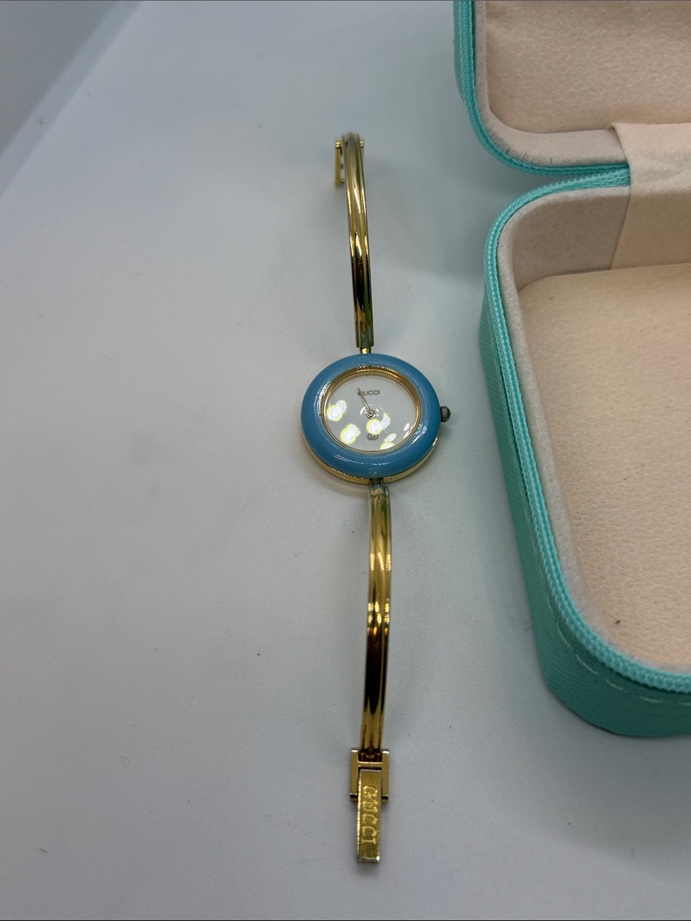 Gucci Gold Bangle Watch with Light Blue Bezel and Interchangeable Bezels - Picture 2 of 6